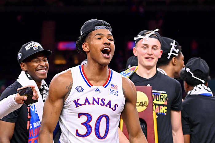 Kansas Jayhawks guard Ochai Agbaji (30) celebrates their win against the North Carolina Tar Heels in the 2022 NCAA men's basketball tournament Final Four championship game at Caesars Superdome.